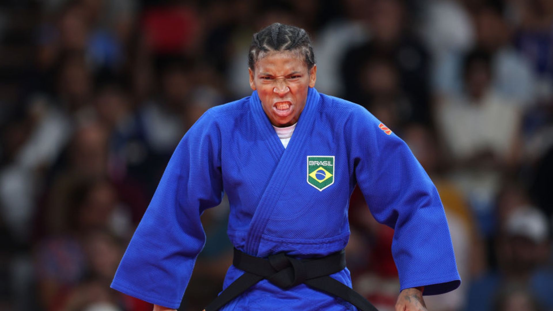 Rafaela Silva comemorando a conquista da medalha de bronze no Grand Slam de Astana